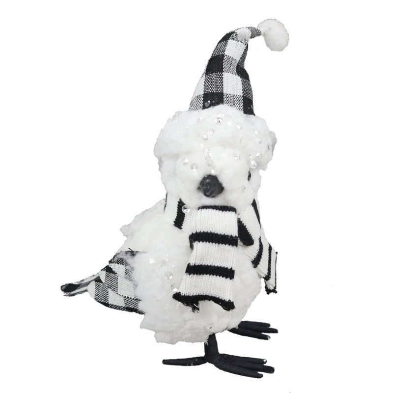 Oiseau, chapeau et écharpe