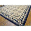 Tapis chinois à motif floral antique ivoire et bleu