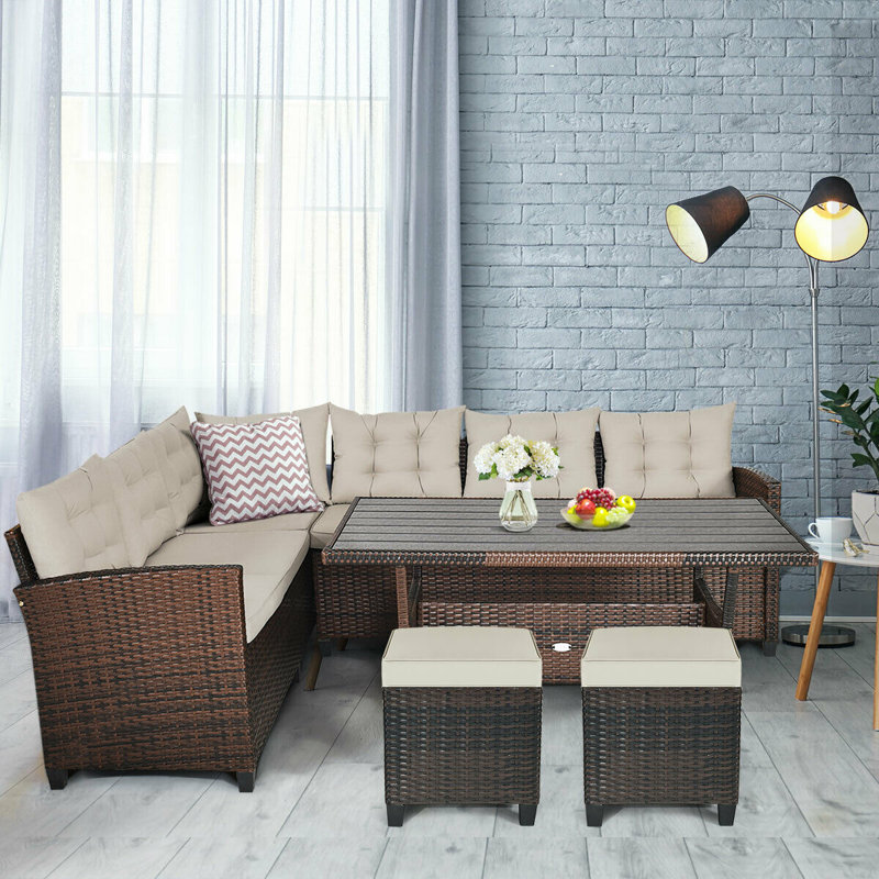 Hearston 8 - Person Patio Dining Set Rectangular Table with Cushions Included