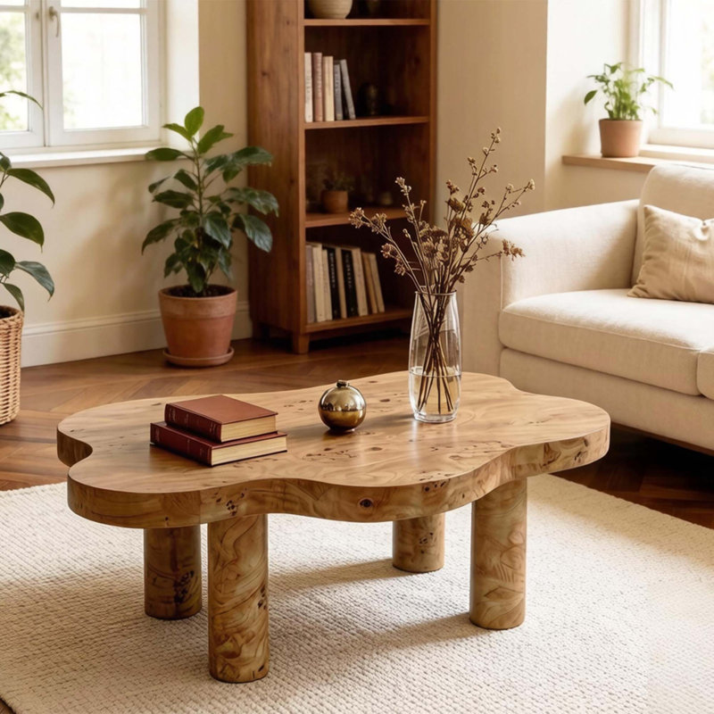 Table basse moderne en forme de nuage avec base robuste et placage de bois de ronce