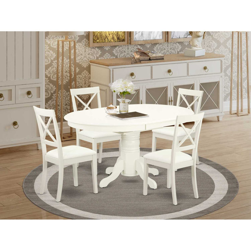 L'ensemble de salle à manger 5 pièces comprend une table de salle à manger ovale avec rallonge papillon et 4 chaises rembourrées en similicuir, blanc lin