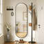Miroir mural ovale en métal-669632244