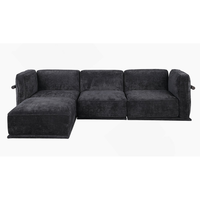 Ceci est un ensemble de canapé modulaire en tissu, comprenant un module d'angle et plusieurs sièges indépendants, jumelé avec des repose-pieds carrés du même matériau.