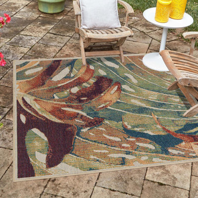 Tapis intérieur / extérieur vert / rouge à motif abstrait Tinesford
