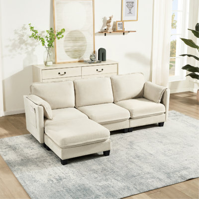 Canapé d'angle de 236 cm (93 pouces) en velours côtelé, mousse, rangement amovible, 3 places assises pour un confort optimal. Structure robuste, siège en coton et lin, mousse élastique, tabouret mobile, assemblage personnalisé.
