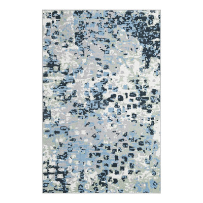 Tapis en polyester tissé à la machine Azion en gris / bleu marine / ivoire