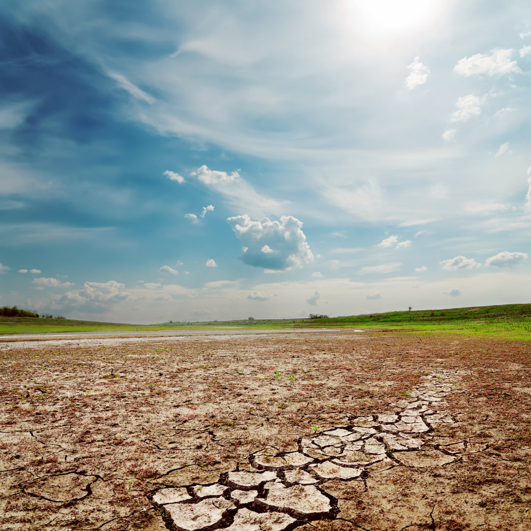 Cloudy Sky Over Drought Land by Mycola - Wrapped Canvas Print