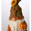 Gnome heureux sur citrouille