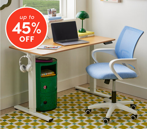 Desks up to 45% off featuring wood desk with laptop, green lamp, and blue mesh office chair