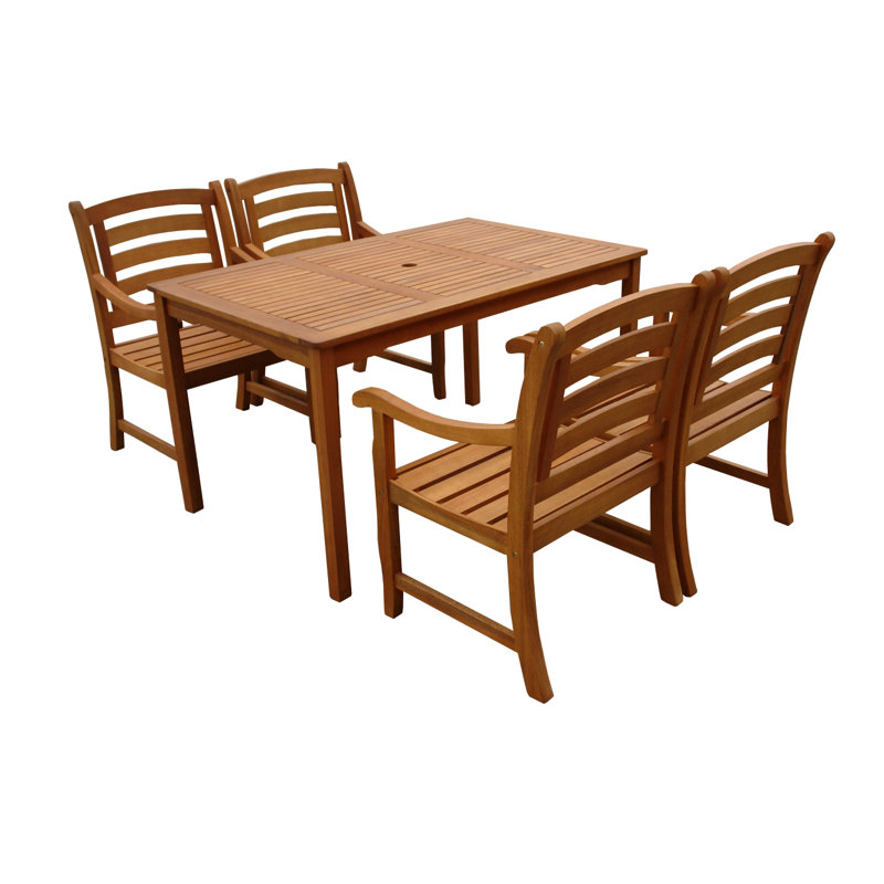 Izaguirre 4 - Person Eucalyptus Solid Wood Patio Dining Set Umbrella Hole Included Rectangular Table