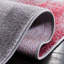 Tapis gris / rouge à motif abstrait-1886341768