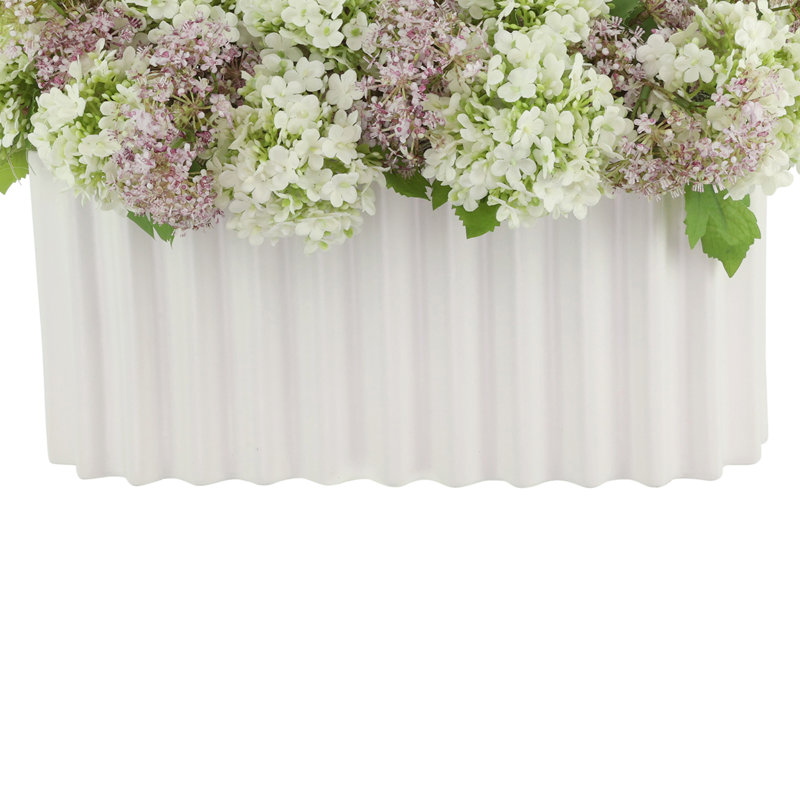 Viburnum and Weeping Laurel Arranged in a Ceramic Vase