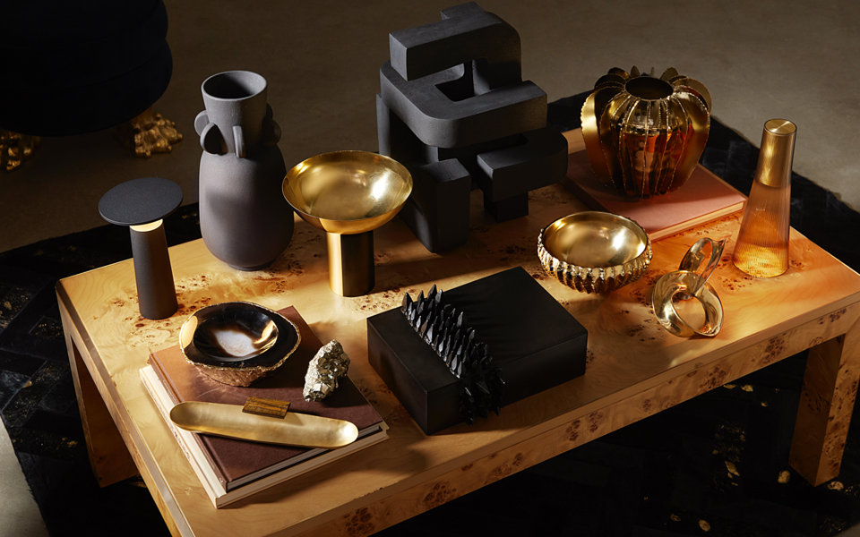 Assorted home decor on a wooden coffee table.
