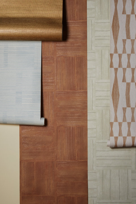 Wallpaper rolls with geometric patterns.
