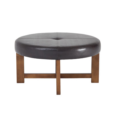 Linden Mid-Century Modern Faux Leather Round Ottoman Coffee Table With Solid Wood Cross-Base