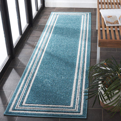 Tapis Brysin 634 en turquoise / ivoire