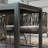 Raydell Rectangular Polyethylene (PE) Wicker Outdoor Dining Table