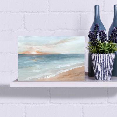 Serene Sunrise Over Calm Waters by Ian C - Wrapped Canvas Print