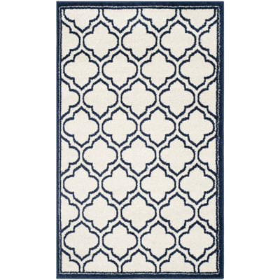 Ammundsen Geometric Area Rug in Ivory/Navy