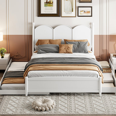 Grand lit blanc avec lit gigogne simple TG et 2 grands compartiments de rangement.