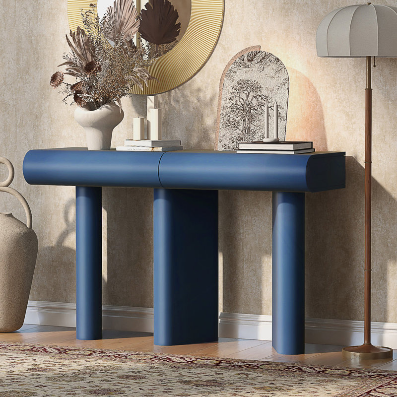 Table d'entrée moderne avec tiroirs courbés et pieds géométriques pour un rangement peu encombrant dans les petits espaces.