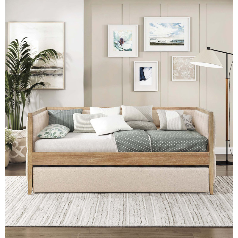 Lit de jour moderne avec lit gigogne escamotable, revêtement capitonné et finition naturelle pour la chambre à coucher ou le salon.