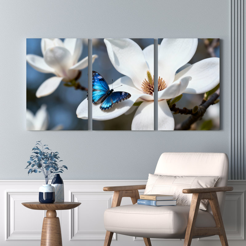 Ensemble de 3 tableaux muraux sur toile tendue représentant un papillon bleu sur une fleur de magnolia blanche