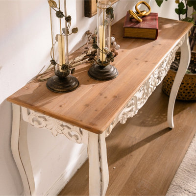 Table console vintage blanche antique avec sculptures florales et design ajouré, idéale pour les intérieurs classiques, robuste (6,7 kg), élégante et décorative, en bois massif, polyvalente pour différents espaces intérieurs.