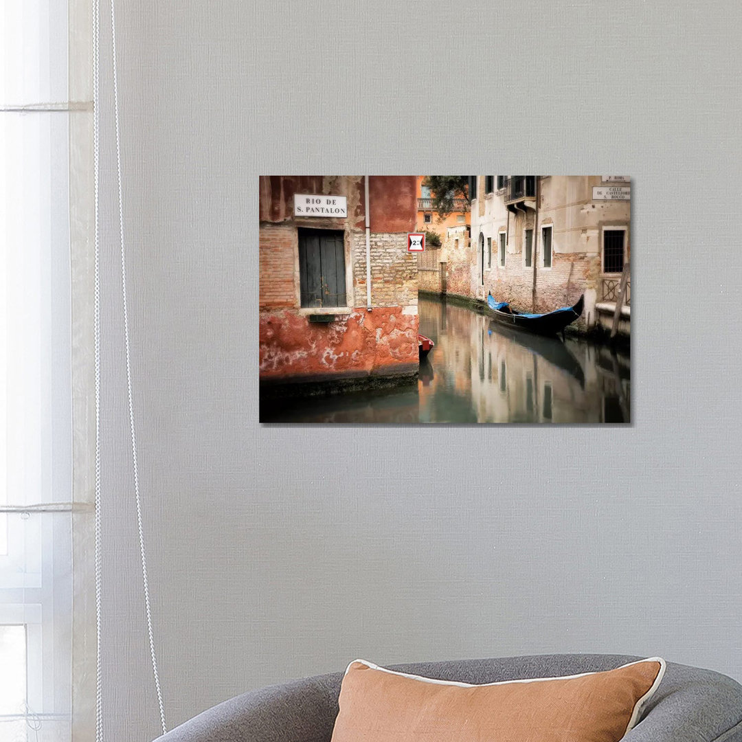 Italy, Venice. Gondola Moored In Canal. by Jaynes Gallery - Wrapped Canvas Print