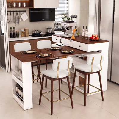 Îlot de cuisine avec table extensible et pivotante, en MDF plaqué noyer, style rétro, et deux tabourets de bar rembourrés en bois.