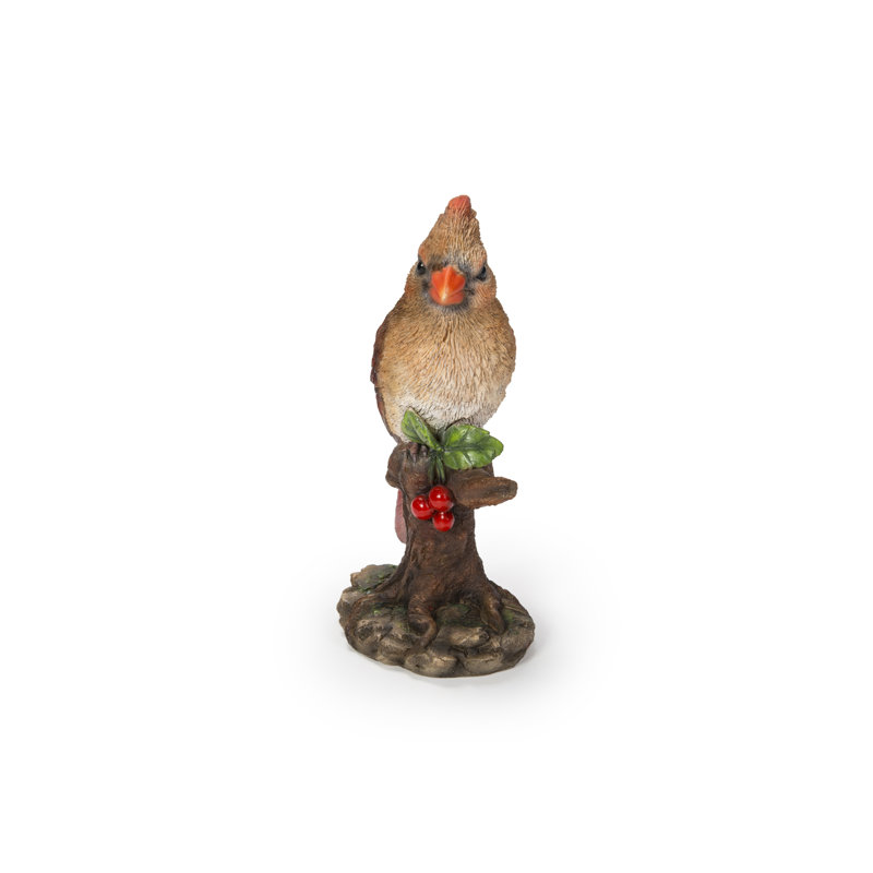 Statue de femme cardinal perché sur une souche