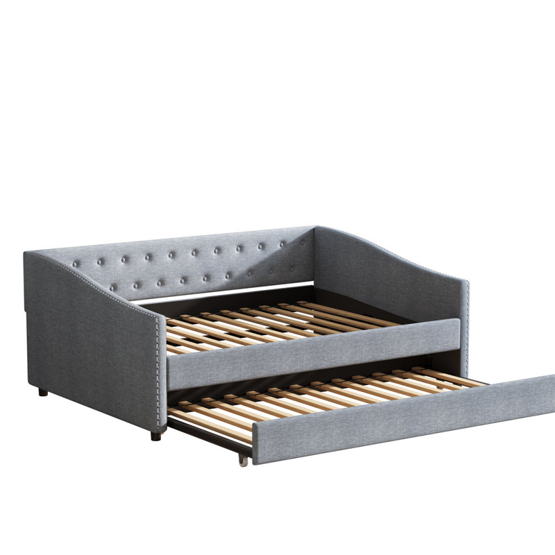 Lit de jour simple gigogne double, lit rembourré gris, dossier orné de boutons, accoudoirs ondulés cloutés en cuivre, coussins en tissu respirant, rembourrage en éponge haute densité, structure solide pour la chambre à coucher