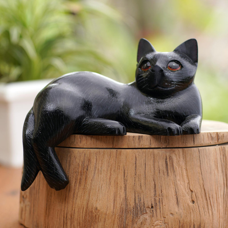 Statuette chat rêveur