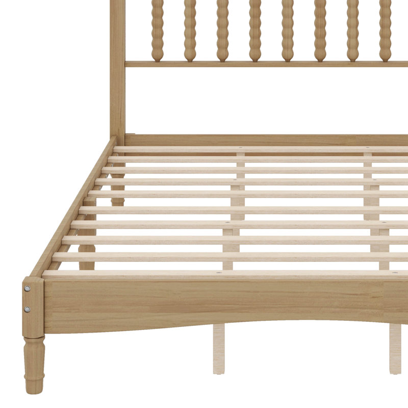 Grand lit plateforme en bois avec tête de lit en forme de gourde