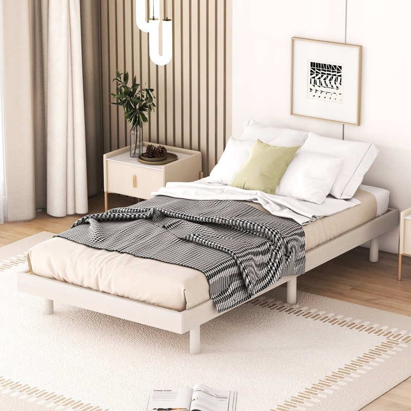 Structure de lit simple moderne blanc délavé - présente une conception flottante pour une plateforme de style améliorée dans un environnement de chambre à coucher stable et élégant