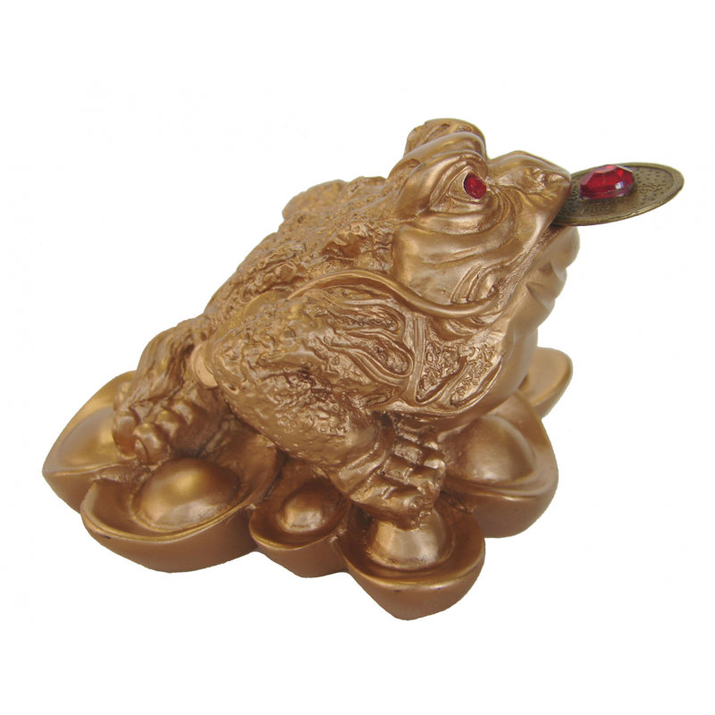 Figurine grenouille d’argent sur des pouces