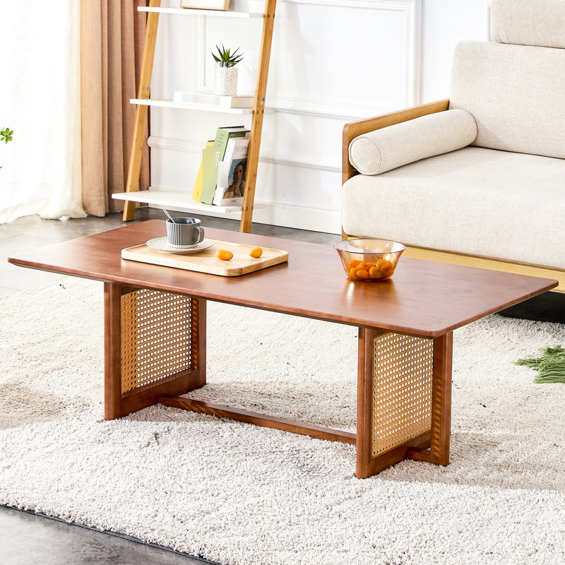 La table basse rectangulaire en bois massif de couleur noyer rehausse à la fois la maison et le bureau pour les petits salons