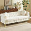Luxueux canapé Chesterfield en velours de 82 pouces avec des clous en cuivre, des boutons capitonnés et des pieds en métal, y compris deux coussins ronds pour plus de confort.