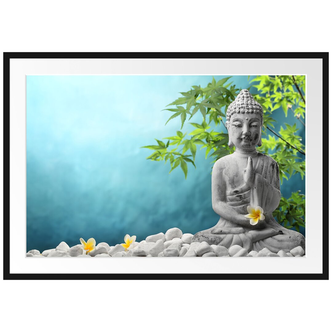 Gerahmtes Poster Buddha auf Steinen mit Monoi Blüte