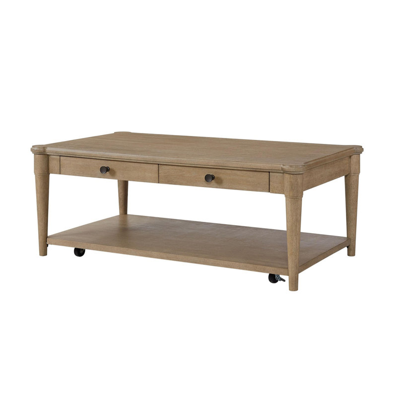 Table basse couleur sable avec deux tiroirs de rangement et roulettes