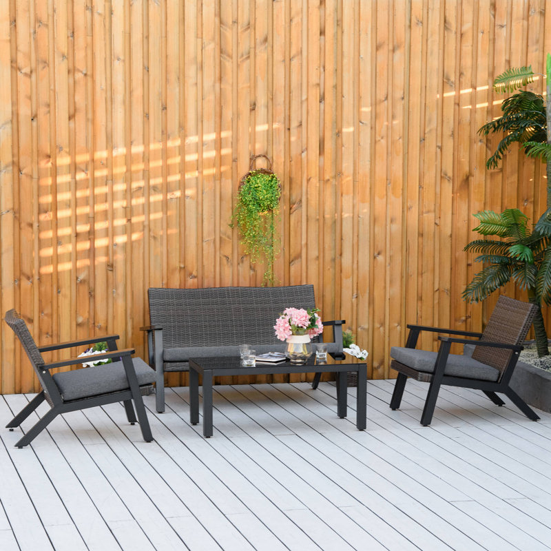 Ensemble de canapé de patio 4 pièces Red Barrel Studio®, canapé d'extérieur en rotin PE avec 2 canapés rembourrés, 1 causeuse et une table basse avec plateau en verre trempé pour le jardin, la cour