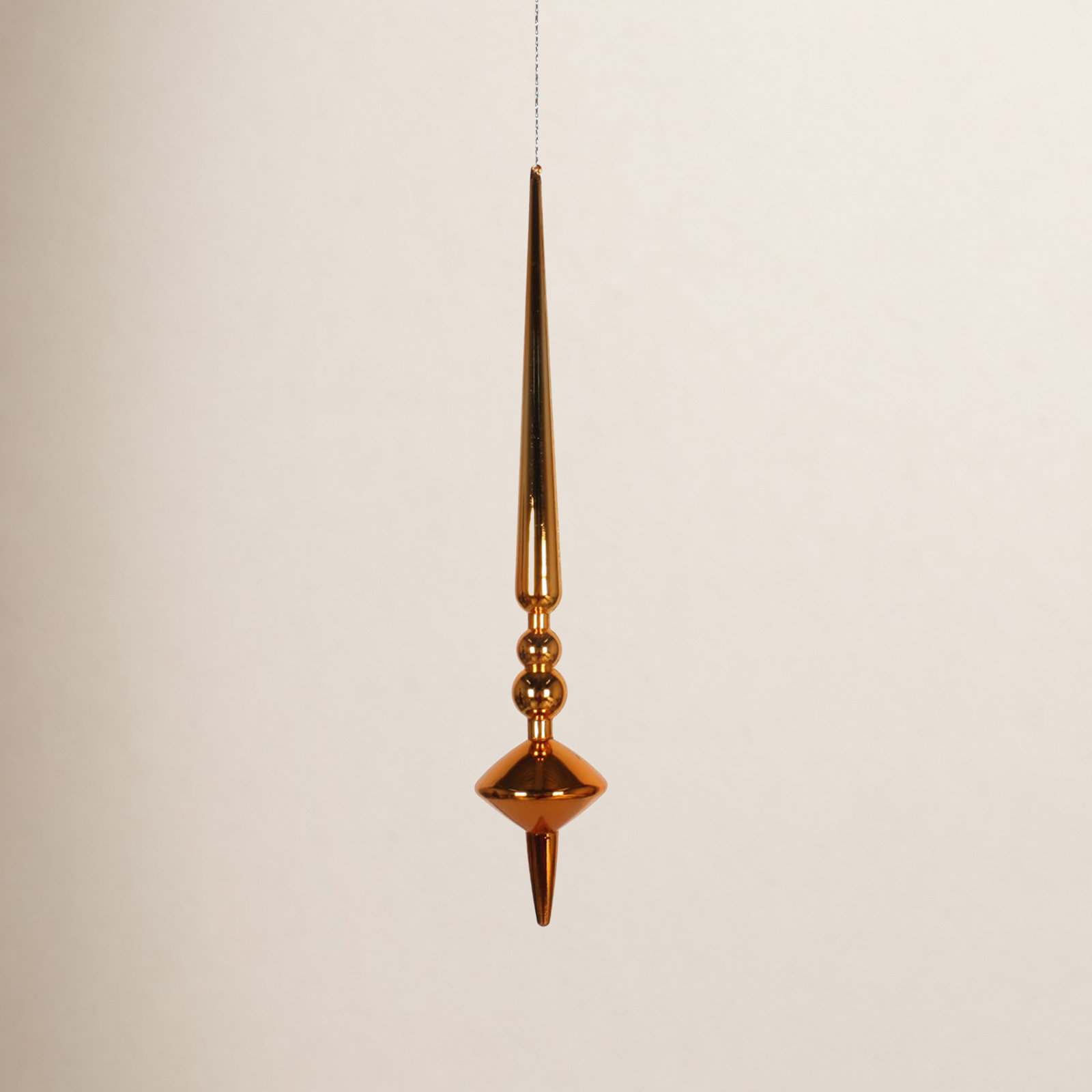  18" Antique Gold Shiny Cupola Finial. This long finial ornament adds depth and texture to any holiday decorating project. Made with shatterproof plastic.