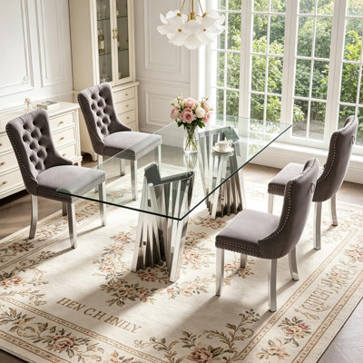 Ensemble de table et chaises de salle à manger modernes et luxueuses en verre de 178 cm (70 po) pour 4 personnes, comprenant une table de cuisine 5 pièces avec un piètement unique en acier inoxydable argenté et 4 chaises de salle à manger rembourrées en velours gris, plateau en verre trempé, résistant aux taches et facile à nettoyer.