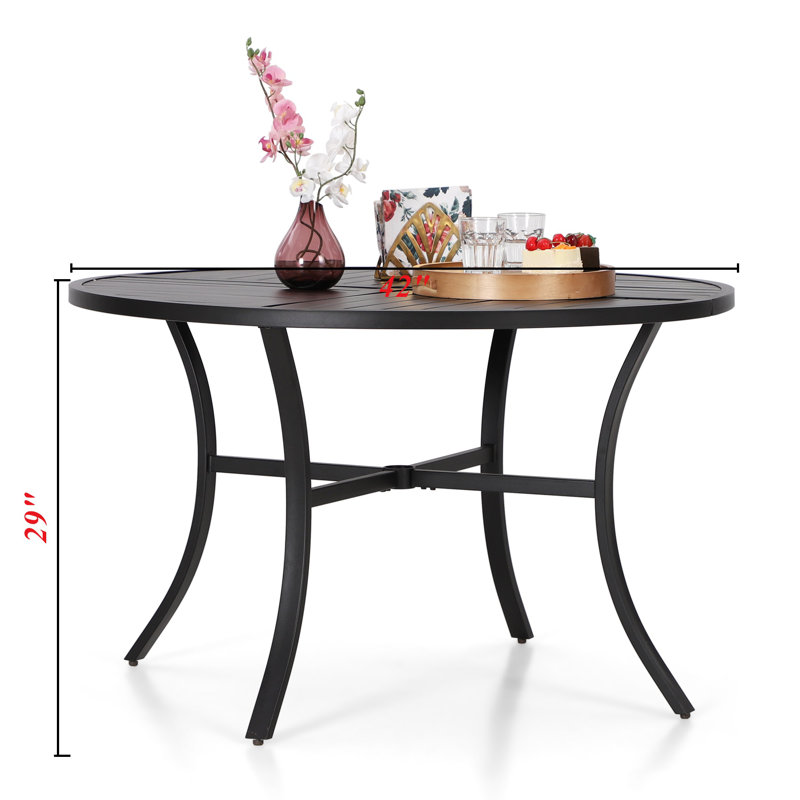 Argyri 4 - Person Patio Dining Set with Round Table , Cushions Included