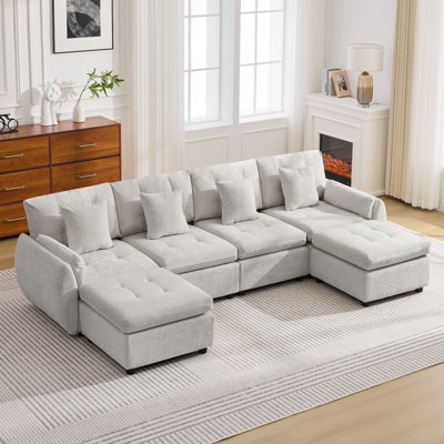 Ensemble de canapé modulaire avec repose-pieds capitonné et dossier coussiné