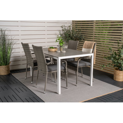 Hiran 4 - Person Patio Dining Set with Rectangular Table , Cushions Included