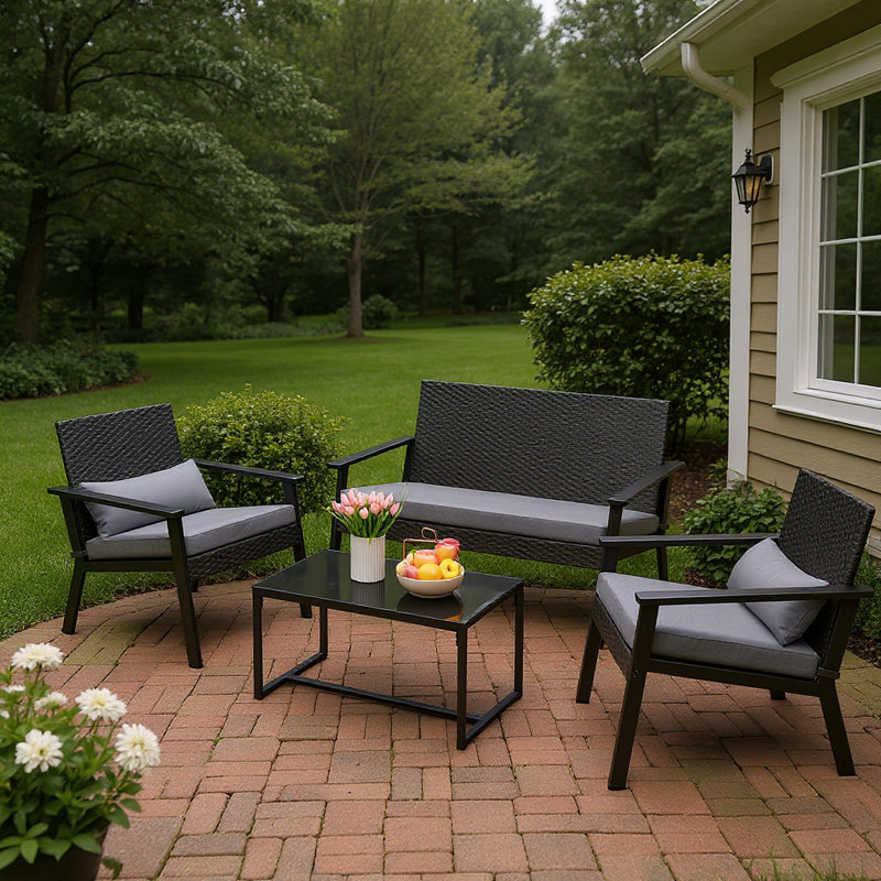 Ensemble de patio 4 pièces en osier 4 personnes - Causeuse, chaise et table basse avec coussins