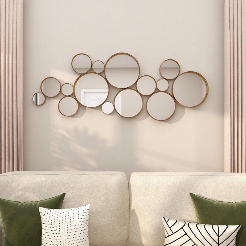 Miroir mural rond en métal doré