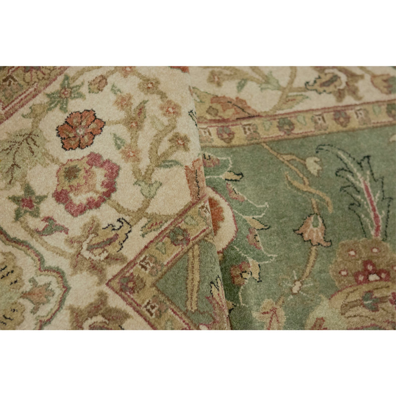 Hand Knotted Wool Oriental Area Rug in Green And Ivory