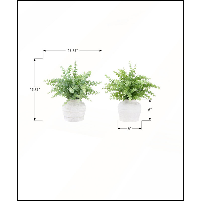Ensemble de 2 brins d'eucalyptus artificiels, 40 cm de hauteur, dans des pots blancs modernes pour une décoration de table contemporaine.